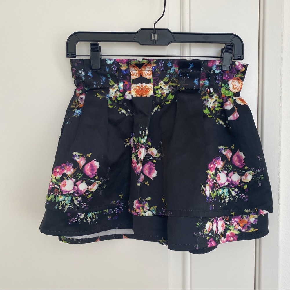 Silken like floral print black mini skirt